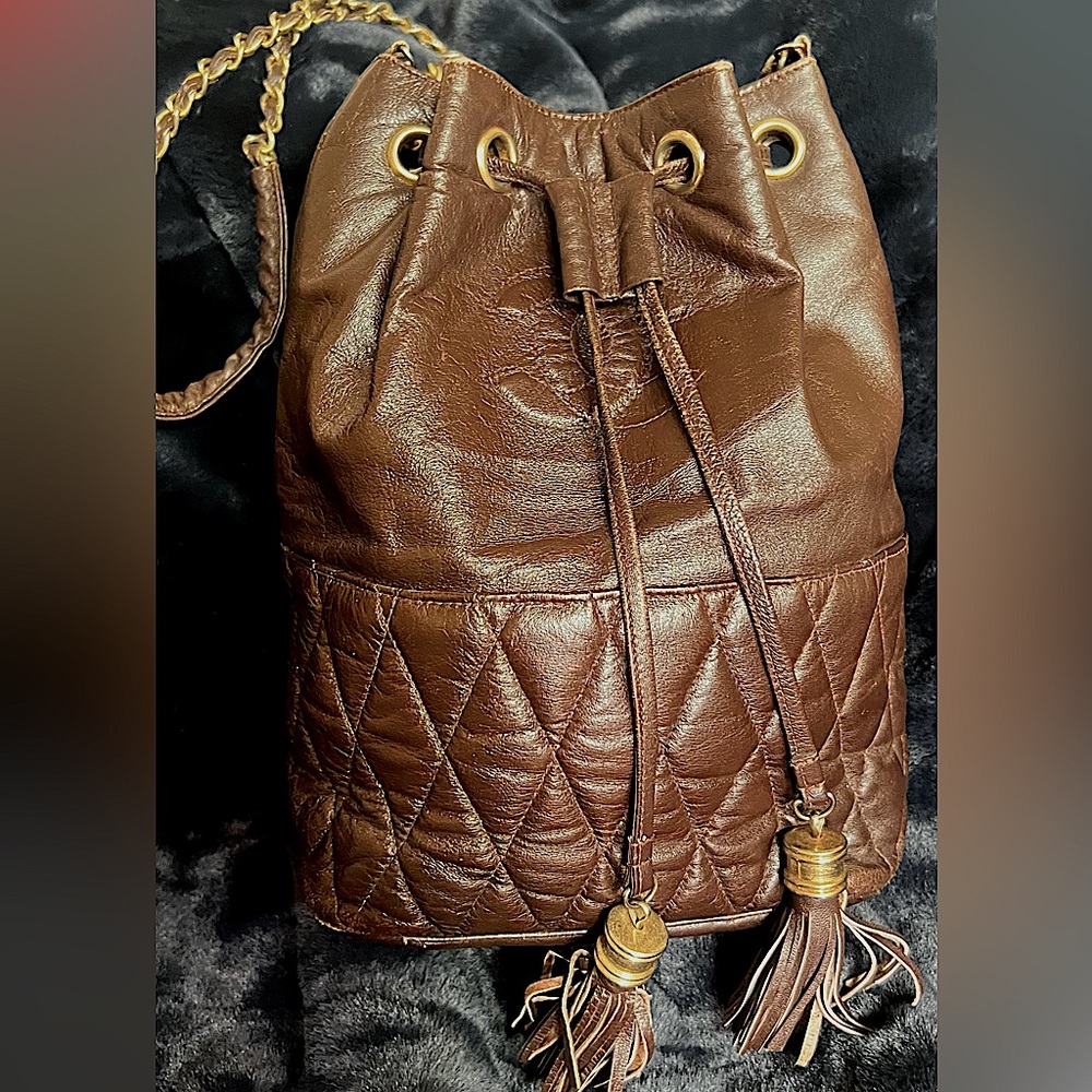 Stylish Brown and Gold Backpack with Drawstring Closure and Quilted Design